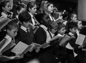 Members of a local school join Promenade to perform at St Peter's Church